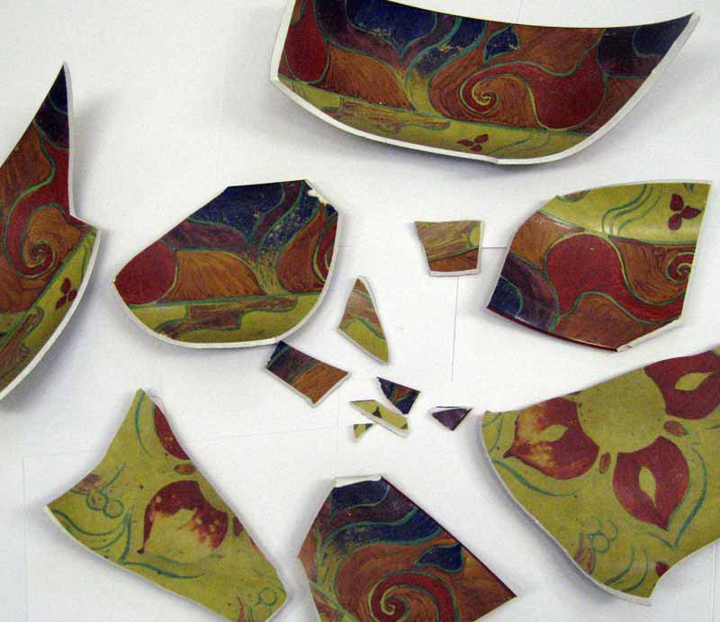 Broken into multiple pieces and shards.